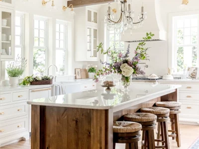 Photo of an English Farmhouse Kitchen addition with wood island and white quartz countertop.