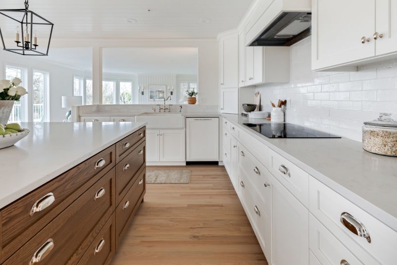 Kitchen view into living room after remodel reveal a refreshing, white, modern farmhouse style.
