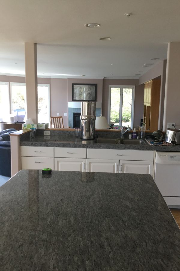 View from 1990's kitchen into living area before remodel by Powell Construction. The overall style felt a bit dated and lacked any special appeal.