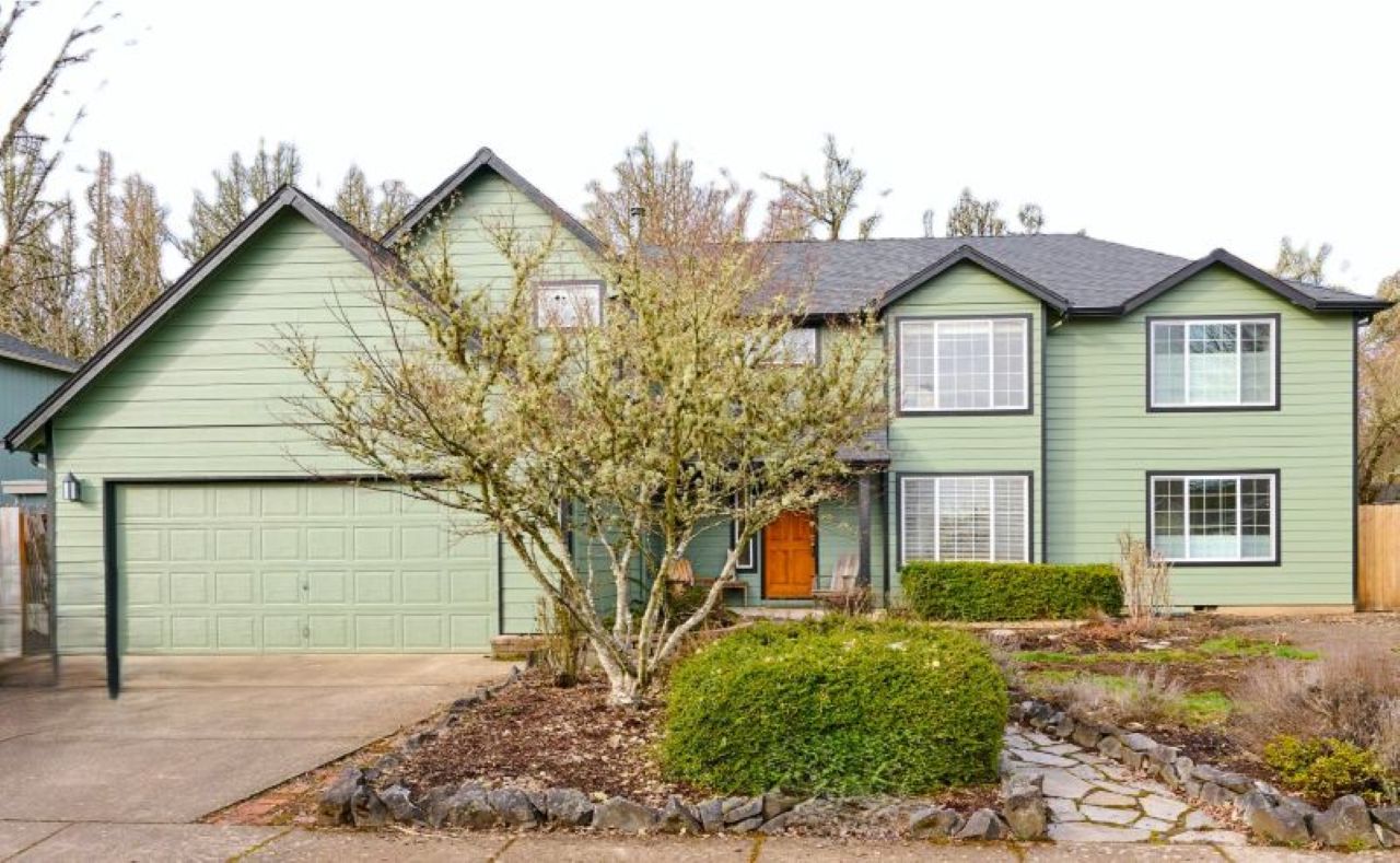 Exterior after two-story addition by Powell Construction.