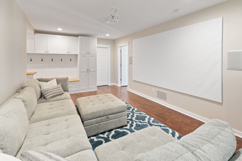 A combination family movie room and mudroom.