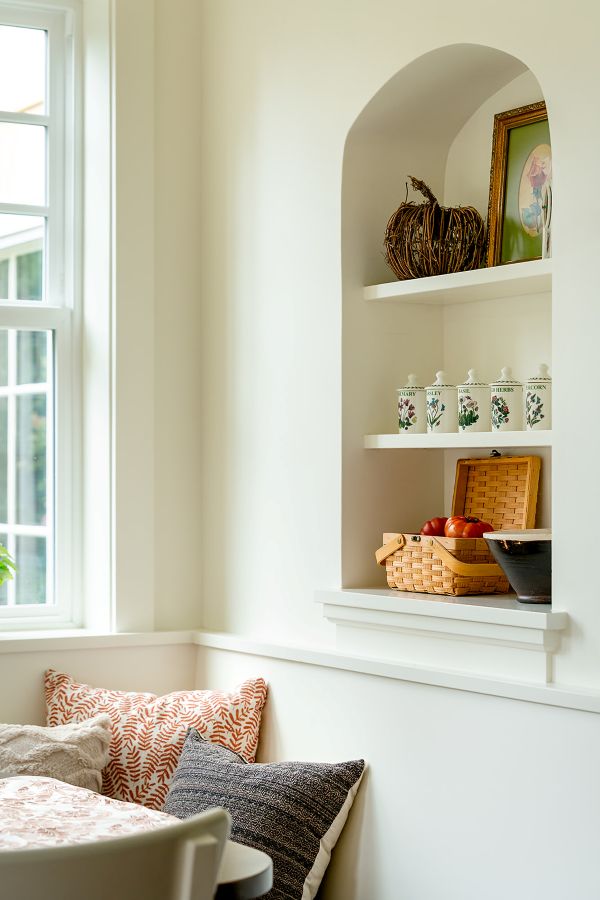 Arched niche in a breakfast nook, adding architectural interest and display space.