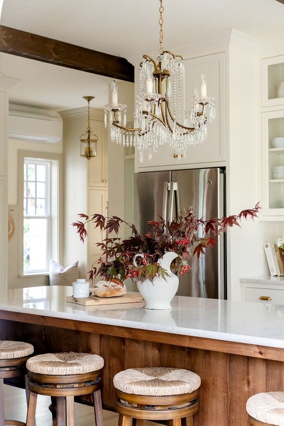 View from breakfast nook seating toward the kitchen island and garden entry vestibule.
