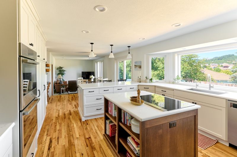 This island's integrated bookcase is a convenient place to store cookbooks and other baking necessities.