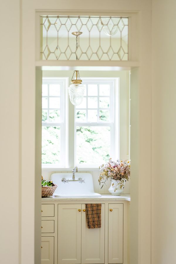 Custom transom over entry way into light filled butler's pantry.