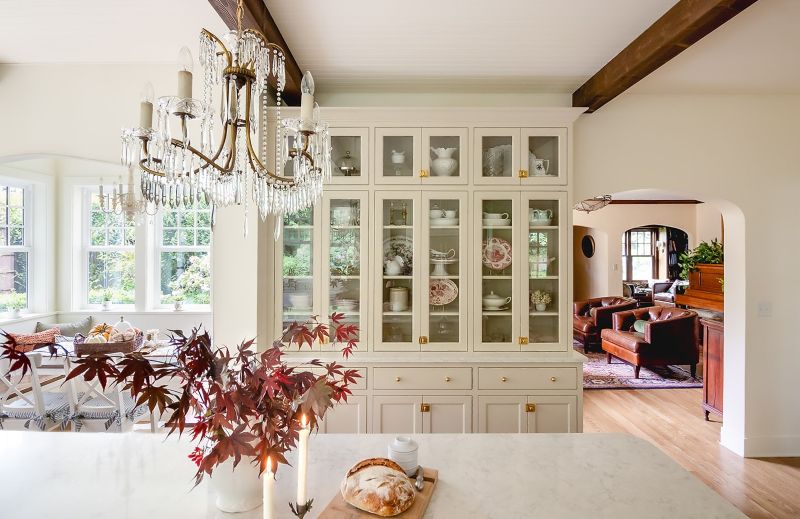 View of a built-in hutch beside breakfast nook, with a glimpse into the adjoining living room.