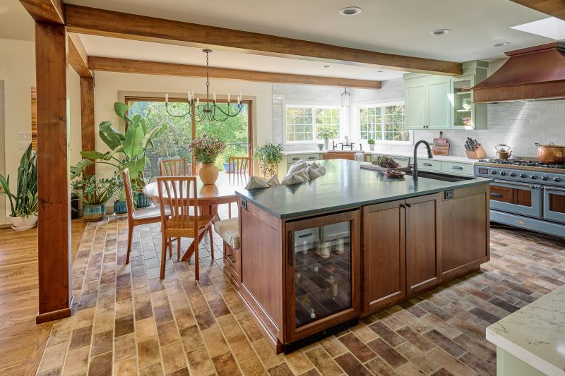 Beverage fridge built into kitchen island.