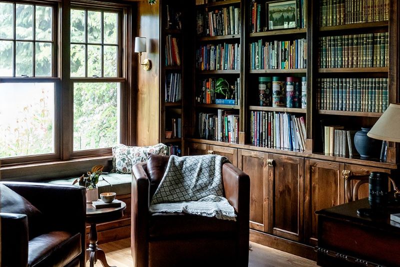 Study with built-in shelves in mahogany shade wood stain.