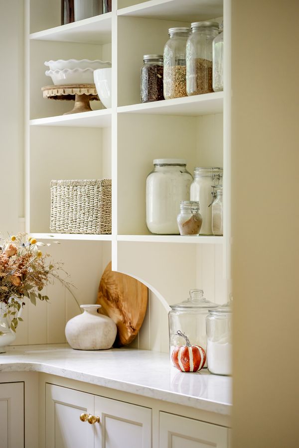Shelf storage for organized pantry, featuring neatly arranged items for easy access.”