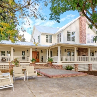 Photo of exterior of a major farmhouse addition by Powell Construction.