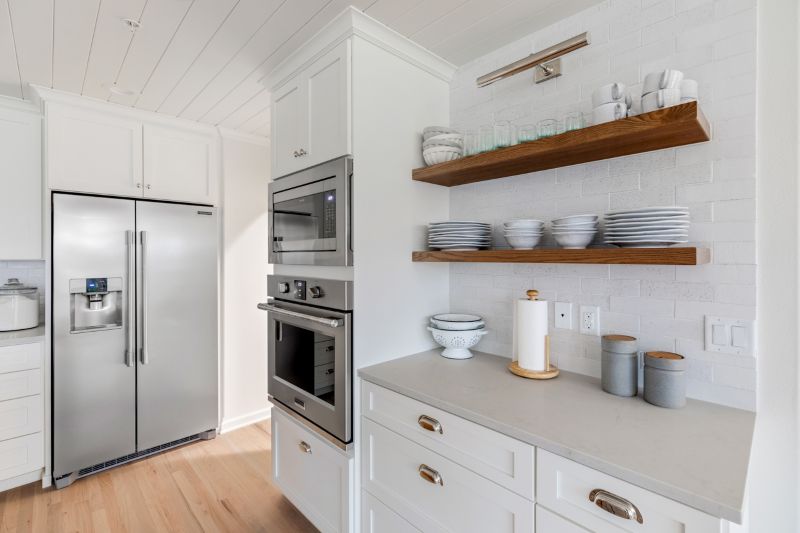 Wall oven and microwave in modern farmhouse kitchen.