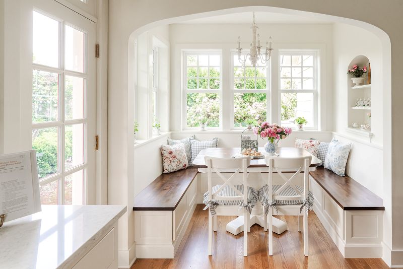 Arched opening into breakfast nook area mimics the home's original architecture