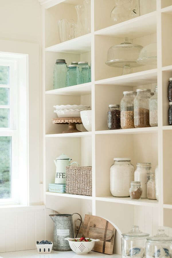 Canning-storage Open shelves are spacious to hold tall vases and jars
