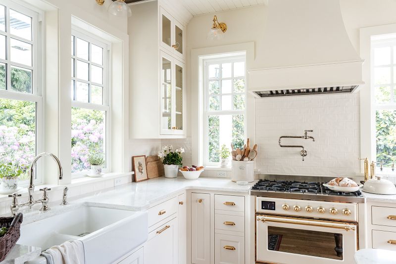 Corner windows in kitchen allow for views and natural light from all angles