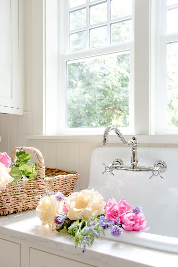 Polished-nickel-faucet Polished nickel bridge style faucet at garden sink