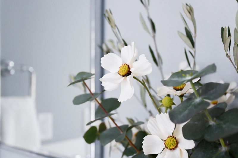 Gorgeous white flowers set amongst greenery in floral bouquet.