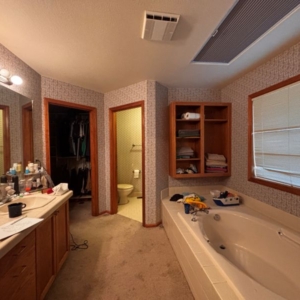 Overall photo of dated, 1990's bathroom prior to complete remodel by Powell Construction.