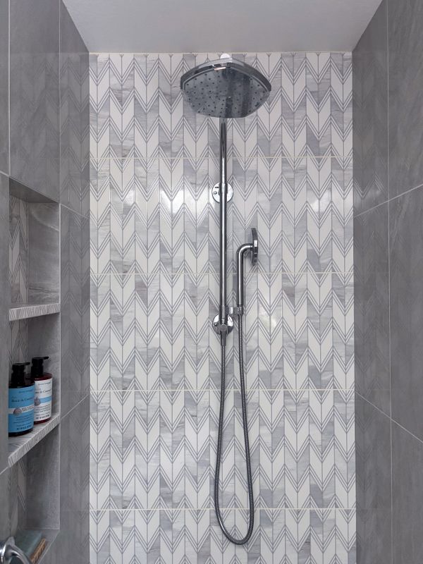 Polished chrome shower head with handheld feature.