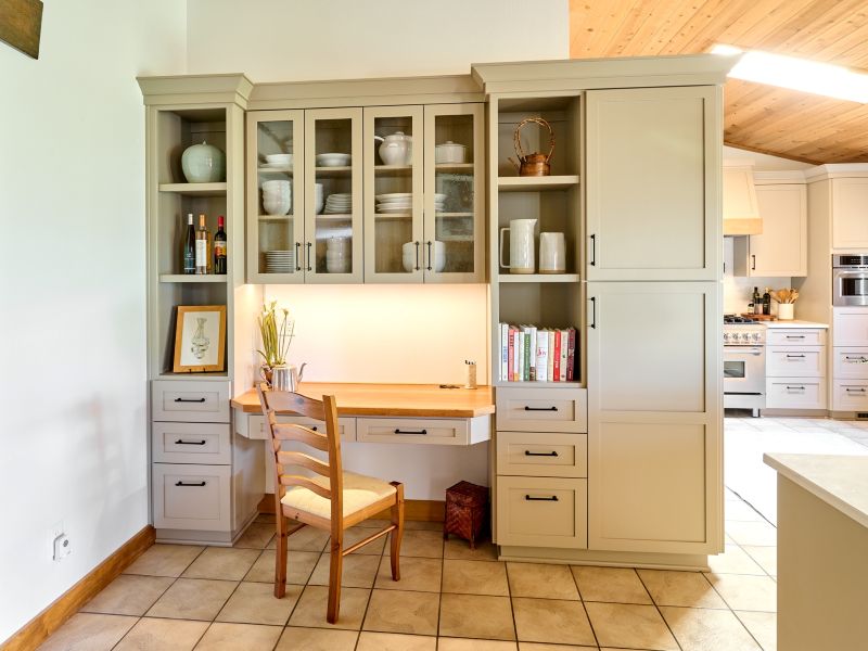 This hutch was integrated adjacent to the kitchen, providing the perfect space to incorporate dish display and a functional desk space.