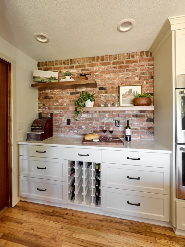 Built-in wine bar with brick backsplash is rustic, yet stunning.