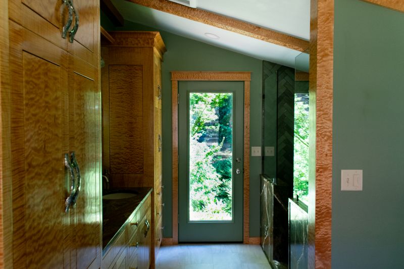 Full-light door from bathroom to exterior, hot tub.