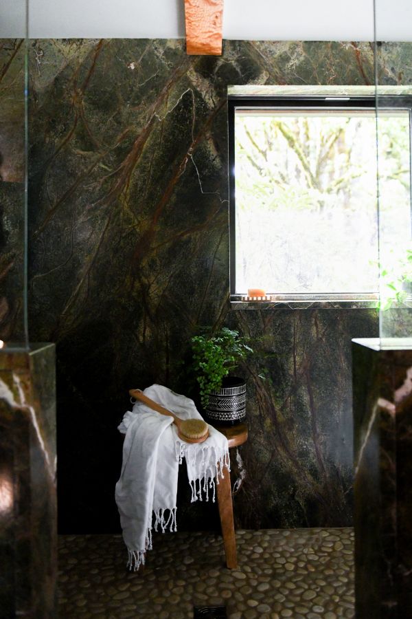 Corner view of shower with bathstool.
